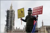  ?? FRANK AUGSTEIN — THE ASSOCIATED PRESS ?? A pro-EU protestor stands in parliament square in front of Parliament during the debate in the House of Commons on the EU (Future Relationsh­ip) Bill in London on Wednesday.