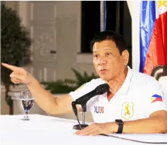  ?? — AFP photo ?? This handout photo shows Duterte gesturing as he speaks during a press conference at the presidenti­al guest house in Davao City.