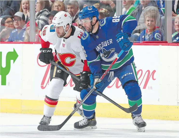  ?? — GETTY IMAGES FILES ?? Sam Gagner, right, can thank the Flames’ Tanner Glass for his current opportunit­y with the Canucks as his shove led to Loui Eriksson’s recent knee injury.