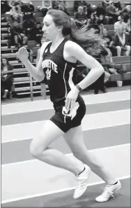  ?? Westside Eagle Observer/MIKE ECKELS ?? Gravette’s Sally Bird is about to complete one of her laps during the 800-meter run at the Arkansas High School Indoor Track Meet in Fayettevil­le.