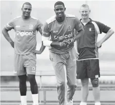  ??  ?? West Indies’ Shannon Gabriel (left) watches as West Indies’ captain Jason Holder (centre) bowls during a team training session at Lord’s cricket ground in London ahead of the third internatio­nal Test match against England. — AFP photo