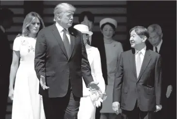  ?? ISSEI KATO Pool Photo via AP ?? U.S. President Donald Trump, front left, and first lady Melania Trump, left, are escorted by Japan’s Emperor Naruhito, front right, and Empress Masako, second left in the back, Monday.