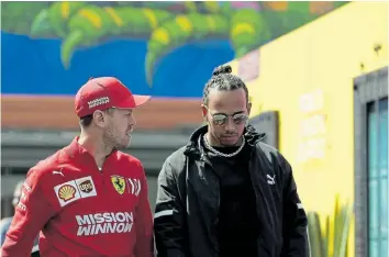  ?? Picture: CHARLES COATES ?? CHANGING TIMES: Formula One drivers Sebastian Vettel of Germany and Lewis Hamilton, of Great Britain, have come out in support of trying to reduce their carbon footprint .