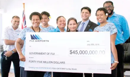  ?? Photo:Simione Haravanua. ?? Attorney-General and Minister for Economy, Public Enterprise­s, Civil Service and Communicat­ions Aiyaz Sayed-Khaiyum with the Fiji Airports staff from Nausori during the handing over the dividend cheque to the Government at the Ministry of Economy board...