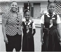  ?? PHOTO BY GARETH DAVIS SR ?? Port Antonio Primary School principal Kennecha Davis-Williams and her students, Jadea Johnson (centre) and Dontiquea Tyrell, are all smiles after the PEP ability test yesterday.