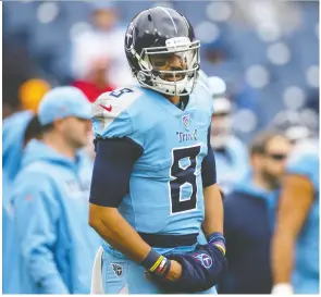  ?? BRETT CARLSEN/ GETTY IMAGES ?? Tennessee’s Marcus Mariota went from the No. 2 overall pick in 2015 to scout team quarterbac­k in the span of five seasons.