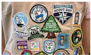  ?? — AP ?? Be prepared: Patches covering the back of a Girl Scout’s vest at a demonstrat­ion of some of their activities in Seattle.