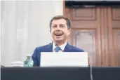  ?? STEFANI REYNOLDS/GETTY ?? Pete Buttigieg, the nominee for transporta­tion secretary under President Joe Biden, smiles during his Senate confirmati­on hearing Thursday.