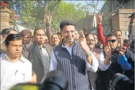  ?? HT PHOTO ?? State Congress chief Sachin Pilot shows his ink mark after casting vote at a polling booth in Jalupura school in Jaipur on Friday.