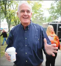  ?? Ernest A. Brown photo ?? Roger Begin, who started Autumnfest 40 years ago, reminisces about the very first Autumnfest at World War II Veterans Memorial Park in Woonsocket Saturday morning. “It felt like magic,” he said. “People were pouring in and that’s when we knew Autumnfest would be a success.” Later on, during the opening ceremony, he went on to tell the crowd assembled that that’s why Autumnfest continues, because of “people like you.” Begin still carries the same excitement as he did 40 years ago, although he stated, “my hair was a little darker then!”