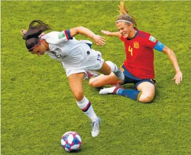  ?? AP PHOTO/THIBAULT CAMUS ?? The United States’ Alex Morgan, front, duels for the ball with Spain’s Irene Paredes during their Women’s World Cup roundof-16 match Monday at Stade Auguste-Delaune in Reims, France. The United States won 2-1.