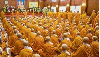  ?? — AFP ?? Last respects: Buddhist monks praying in front of a portrait of Quang at the Viet Nam Quoc Tu Pagoda in Ho Chi Minh City.