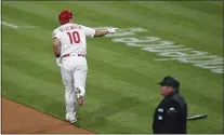  ?? DERIK HAMILTON - FOR THE ASSOCIATED PRESS ?? Phillies catcher J.T. Realmuto bids his dugout a hardy hello Monday night after hitting a two-run home run during the first inning of what became a 4-3Phils win over the Milwaukee Brewers.