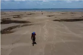  ?? Photograph: Edmar Barros/AP ?? More than 600,000 people have been affected by the Amazonas drought, while the Rio Negro’s water levels are at a 121-year low.