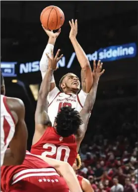  ?? Craven Whitlow/News-Times ?? Thunder Dan strikes again: El Dorado native Daniel Gafford goes up for a bucket against Indiana in Arkansas' 73-72 win on Sunday. Gafford was named SEC Men's Basketball Player of the Week on Monday after leading the Razorbacks to two victories last week.