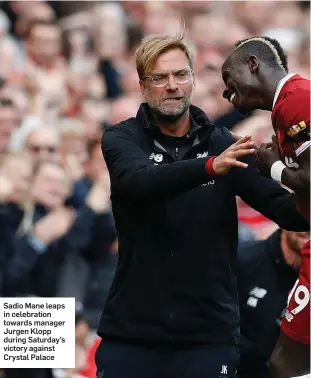  ??  ?? Sadio Mane leaps in celebratio­n towards manager Jurgen Klopp during Saturday’s victory against Crystal Palace