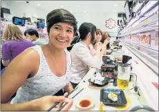  ?? Pictures: SUPPLIED ?? SOMETHING DIFFERENT: Kamini Pather tries a sushi bar in Tokyo, a city she says really piqued her interest