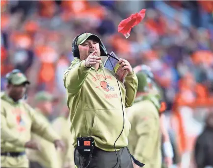  ?? RON CHENOY/USA TODAY SPORTS ?? Browns coach Freddie Kitchens tosses a challenge flag during a game against the Broncos on Sunday in Denver. Cleveland is 2-6 this season, and its offense ranks 25th in the NFL, scoring 19 points a game.