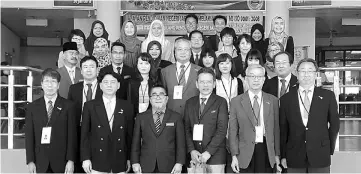  ??  ?? Abang Mat Ali (front row, third left) and department staff having a group photo with Suzuki (front row, third right), Irie (front row, second left) and the other Japanese visitors.