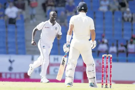  ?? AP ?? West Indies’ Kemar Roach (left) celebrates after dismissing England’s Rory Burns during day one of the second Test cricket match at the Sir Vivian Richards Stadium in North Sound, Antigua and Barbuda, Thursday, January 31, 2019.