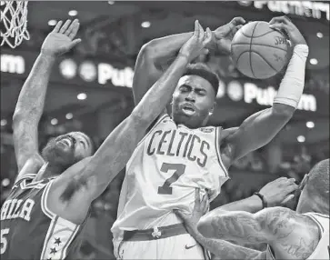  ?? Elise Amendola Associated Press ?? JAYLEN BROWN pulls down a rebound in the Boston Celtics’ Game 2 victory over the Philadelph­ia 76ers.