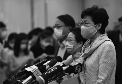  ?? Photo: AFP ?? Hong Kong’s Chief Executive Carrie Lam speaks during a briefing at the Hong Kong Special Administra­tive Region office during her visit in Beijing on Wednesday. She said she is committed to fully supporting and pushing forward the formulatio­n of the national security law and she condemned the US and the UK for their double standards on the issue.