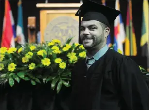  ??  ?? Above, Bryan DeGrace, 32, of Woonsocket, is all smiles after receiving his degree on Sunday. Below, Yamilett Monge-Joubert, 39, also of Woonsocket, received her associate in science degree.