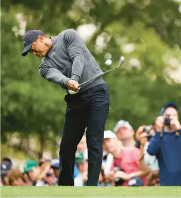  ?? ANDREW REDINGTON/GETTY ?? Despite multiple injuries and significan­t surgeries in recent years and having played only 24 holes of tournament golf in 2024, 48-year-old Tiger Woods will tee it up and try to win a 16th major title this week at the Masters.