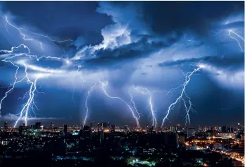  ??  ?? Lightning typically heats the air to some 25,000°C. The high temperatur­e rips electrons away from the atomic nuclei or air molecules, changing their state into plasma.