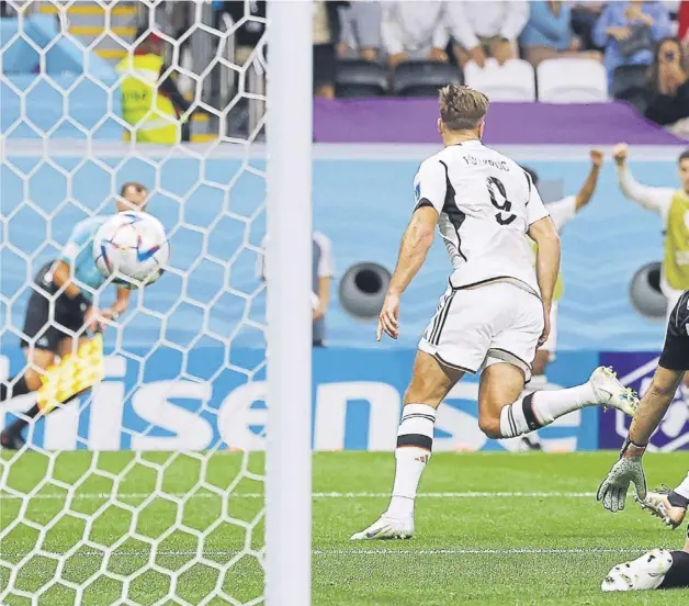  ?? ?? ↑ Germany’s forward Niclas Fullkrug, left, wheels away after equalising against Spain in their World Cup Group E match at the Al-bayt Stadium last night