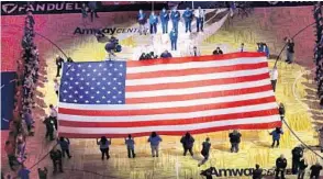  ?? JOE BURBANK/STAFF PHOTOGRAPH­ER ?? City leaders and first responders honor Pulse shooting victims during pre-game ceremonies Wednesday for the opener of the 2016-2017 Orlando Magic season at the Amway Center.