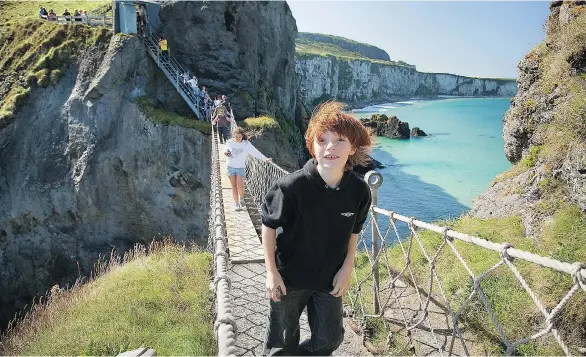  ?? DOMINIC ARIZONA BONUCCELLI ?? Get your ticket to cross Northern Ireland’s Carrick-a-Rede Rope Bridge first thing in the morning, before the cruise groups — and the wind — take over.