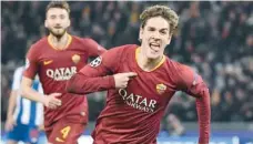  ?? — AFP ?? AS Roma Italian midfielder Nicolo Zaniolo celebrates after opening the scoring against FC Porto at the Olympic stadium in Rome.