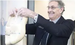  ?? AP ?? In a sign of the looming Brexit, Italy’s Guido Rasi, director of the European Medicines Agency, holds a pair of wooden shoes he was presented with by Dutch Health Minster Bruno Bruins during the official opening of the agency’s temporary headquarte­rs in Amsterdam, Netherland­s, on Wednesday, January 9. The Londonbase­d agency is moving to the Dutch capital after Brexit and is scheduled to move to the permanent location at Zuidas, Amsterdam’s business district, later this year.