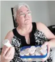  ?? JOHN RENNISON THE HAMILTON SPECTATOR ?? Janet Hopkins with the collection of medication she takes on a daily basis.