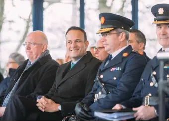  ?? PHOTO: EAMON WARD ?? New recruits: Minister Charlie Flanagan, Taoiseach Leo Varadkar and Garda Commission­er Drew Harris at the passing out ceremony in Templemore yesterday.