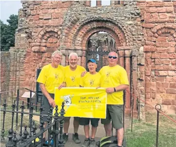  ??  ?? FINE EFFORT: The group, from left, Jake Gibb, Brian Dowling, Donny Mackay and Ian Cameron, walked the St Cuthbert’s Way in memory of Ian Reid, who died of cancer.