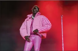  ?? PHOTO BY AMY HARRIS — INVISION — AP, FILE ?? Rapper Young Thug performs at the Lollapaloo­za Music Festival at Grant Park in Chicago on Aug. 1, 2021.