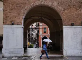  ??  ?? One of the archways of the Palazzo dei Trecento in Treviso, Italy. The city, often upstaged by Venice, is a good place for an afternoon stroll.