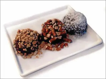  ?? PHOTO COURTESY OF WWW.GODSHALLS.COM ?? Love bacon? These truffles combine dark chocolate, bacon and cream cheese.