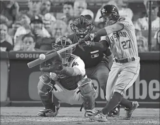  ?? MARK J. TERRILL/AP PHOTO ?? Jose Altuve of the Astros homers in Game 2 of the World Series on Oct. 25 at Los Angeles.