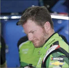  ??  ?? Dale Earnhardt Jr. looks to his car during practice for the NASCAR Cup Series auto race, at Talladega Superspeed­way on Friday in Talladega, Ala. BOB CRISP/THE DAILY HOME VIA AP