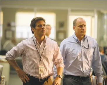  ?? Vertical Entertainm­ent ?? James Marsden (left) and Woody Harrelson play reporters in Rob Reiner’s “Shock and Awe.”