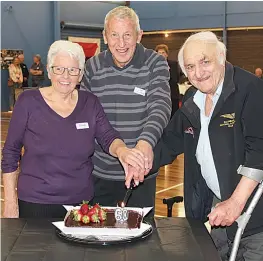  ?? ?? Cutting the 60th anniversar­y cake are life members Elaine Brew and Don Hastings as well as Ernie Matkovich, who played for the club in 1964.