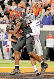  ?? [PHOTO BY SARAH PHIPPS, THE OKLAHOMAN] ?? Oklahoma State’s James Washington, left, caught two touchdown passes in Saturday’s loss to Kansas State. He and his fellow Cowboy seniors will have one last shot at a victory at Boone Pickens Stadium when they host Kansas at 11 a.m. Saturday.