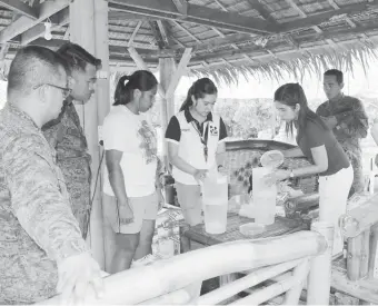  ??  ?? A STAFF from the Department of Science and Technology (DOST) demonstrat­es the installati­on and use of Ceramic Water Filters to the staff of 10th Infantry Battalion, 1st Division in Brgy. Burgos, Oroquieta City. DOST Region 10, through the Provincial Science and Technology Center of Misamis Occidental led by Ms. Eufresnie Ann D. Simbajon, turns over 25 units of Ceramic Water Filter (CWF) to the Provincial Developmen­t Council represente­d by the Provincial Planning and Developmen­t Coordinato­r, Ms. Teresa B. Calamba last 17 May 2019. (DOST-10)