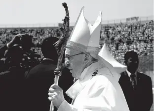  ?? Associated Press ?? Pope Francis celebrates Mass for Egypt's tiny Catholic community Saturday at the Air Defense Stadium in Cairo. Pope Francis came to Egypt on Friday for a historic visit to the Arab and Muslim majority nation aimed at presenting a united...