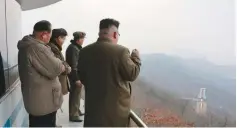  ?? (Reuters) ?? NORTH KOREAN LEADER Kim Jong Un watches the ground jet test of a Korean-style high-thrust engine in a photo released by the regime last month.