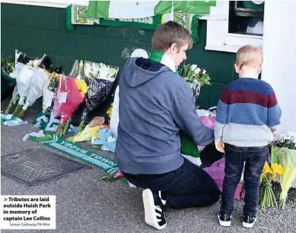  ?? Simon Galloway/PA Wire ?? > Tributes are laid outside Huish Park in memory of captain Lee Collins