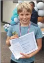  ??  ?? Finn Popplewell with his sportsmans­hip award.